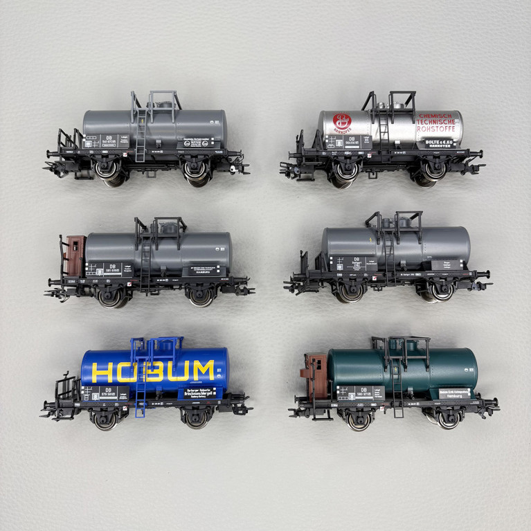6 wagons citernes courts, 2 essieux, "BP, DEA, HOBUM, EVA, BOLTE",DB - TRIX 24170